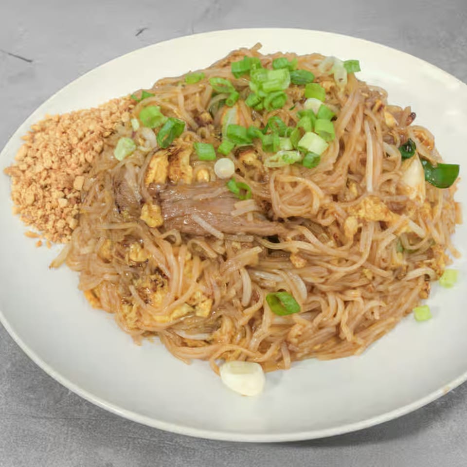 Thai Bliss Pad See Ew with wide rice noodles, beef, egg, and green onions.